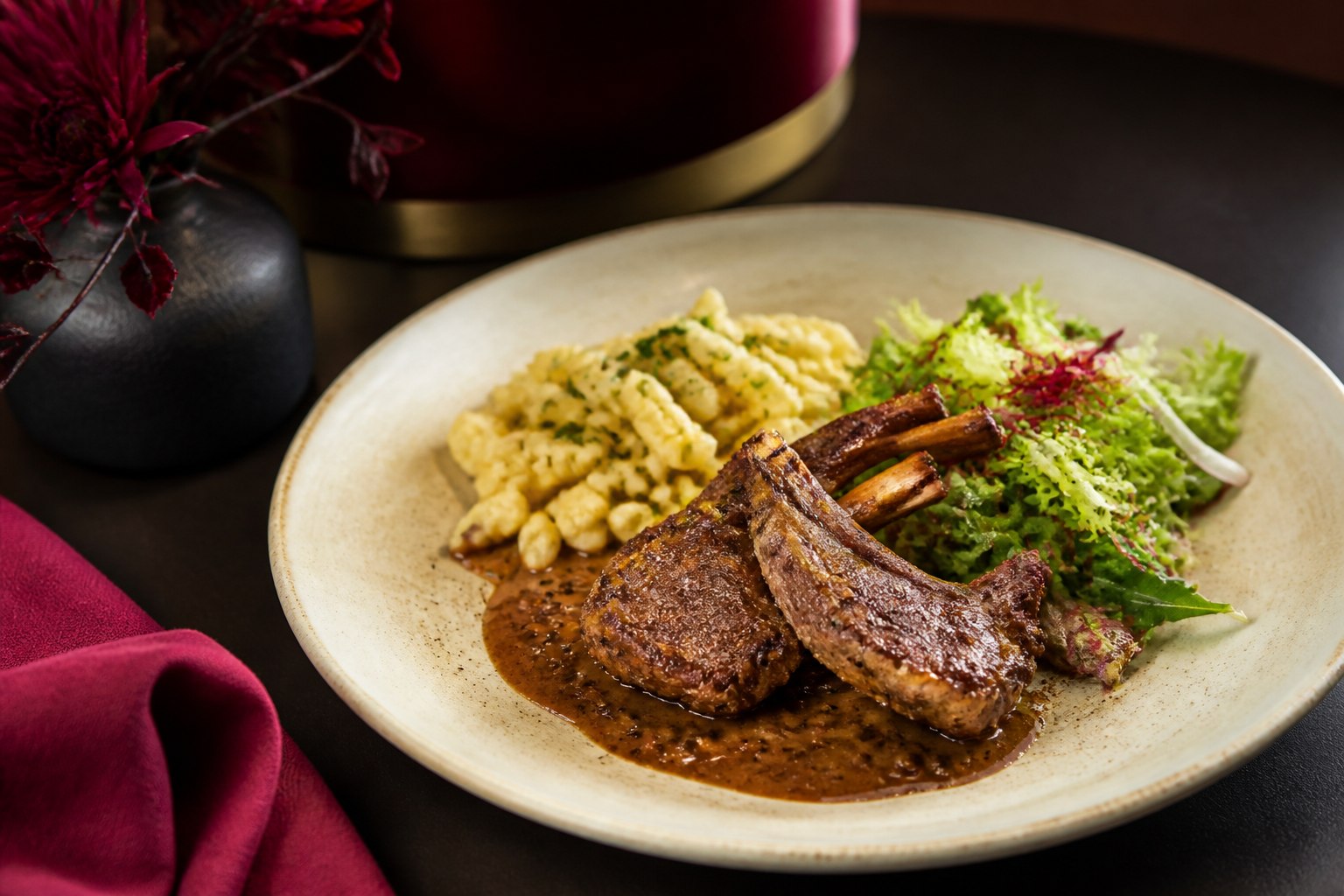 Grilled game chops with pepper sauce, spätzle and salad