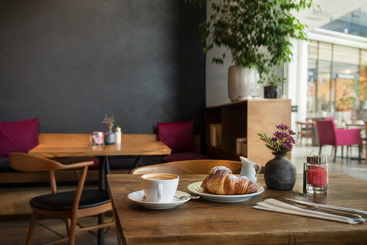 Bright Cafe Schneider-inspired dining room with coffee and pastry on a table